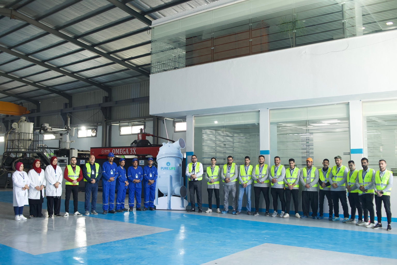 PureLife team together inside the factory