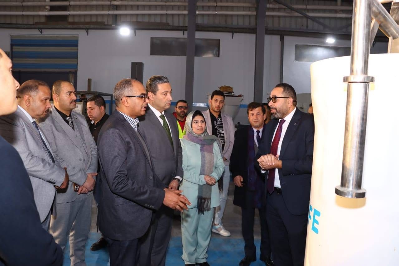 The visiting delegation reviewing a PureLife industrial product
